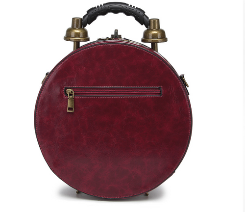 Burgundy steampunk handbag back showing rear zipper pocket and top carry handle