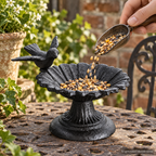 AI-generated lifestyle scene of a person adding birdseed to a cast iron flower feeder