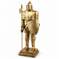 Gold-tone medieval knight armor statue with shield and polearm on white background
